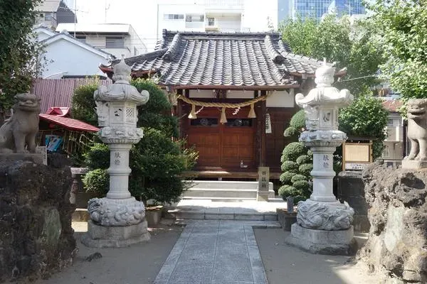 Oshiage Tenso Shrine near Tokyo Skytree with quiet shrine details in an urban setting.