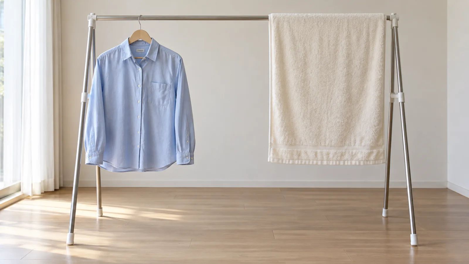 A towel and shirt hanging separately with open space around them.
