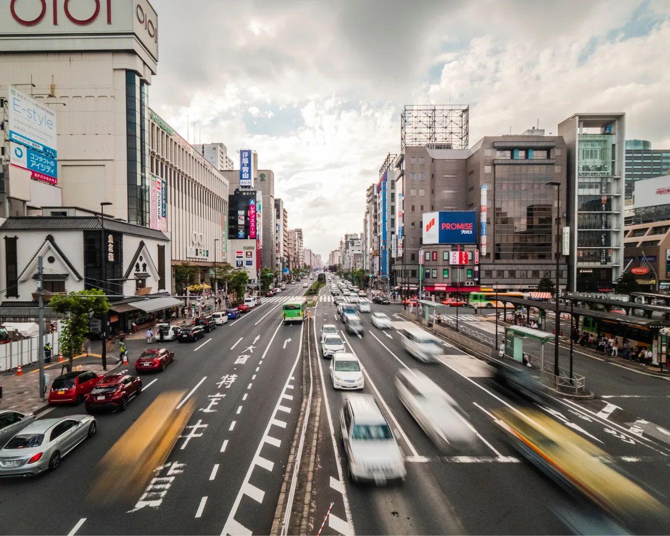 People walking near Kinshicho Station’s supermarket and shopping buildings.