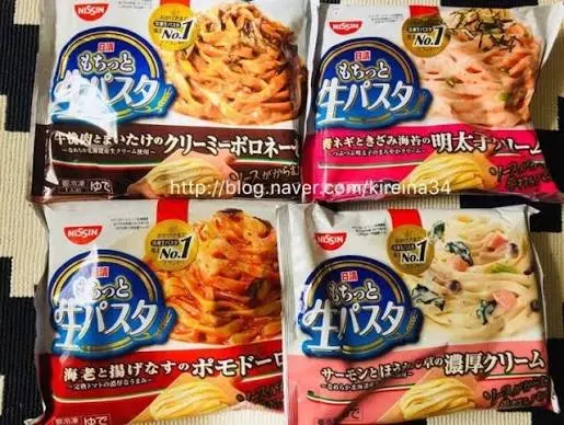 A frozen convenience store meal prepared indoors on a rainy Tokyo evening.