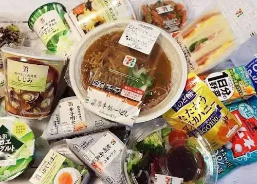 A light convenience store dinner with soup, egg or tofu, salad, and tea.
