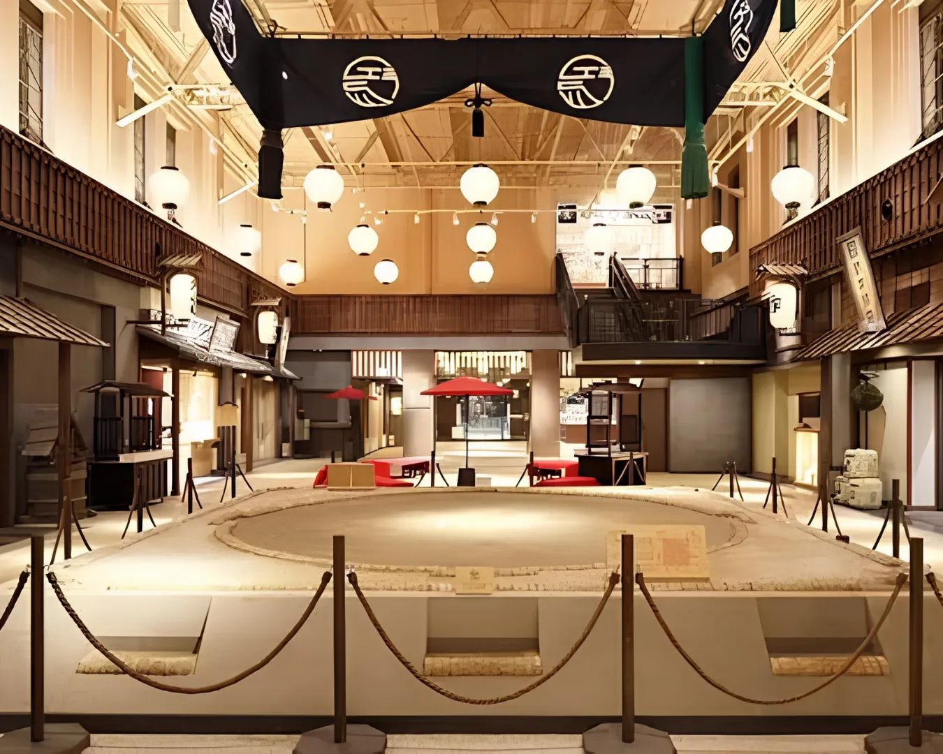 Historic ceremonial sumo aprons displayed with archival photographs at the Sumo Museum in Ryogoku.